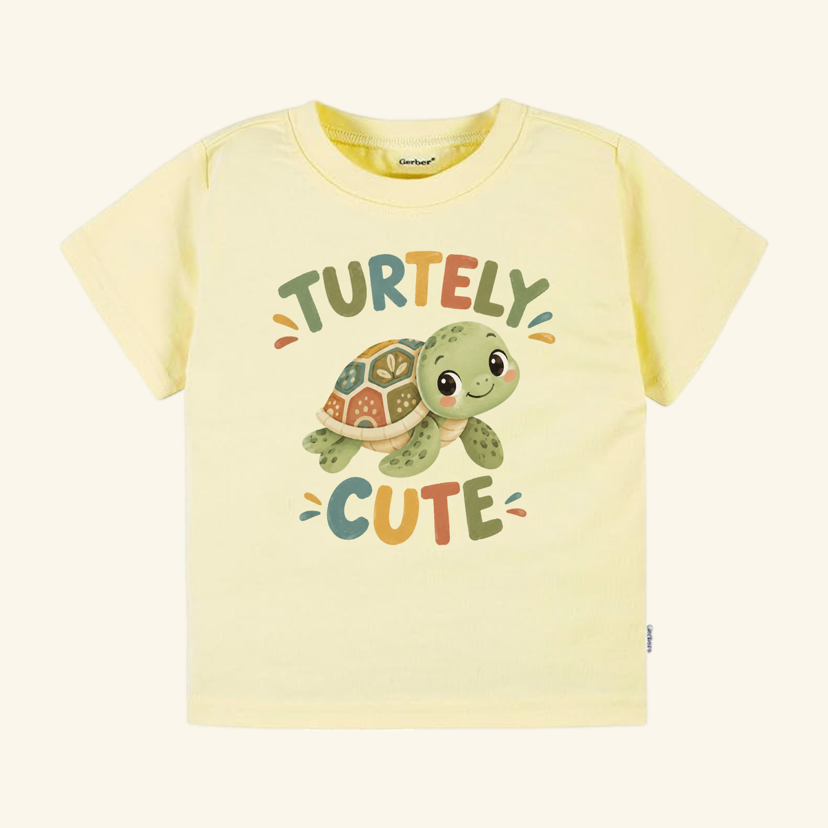 Pale yellow short-sleeve Turtley Cute Toddler Shirt – Watercolor Turtle Short-Sleeve Tee featuring a watercolor turtle illustration and the text TURTELY CUTE.