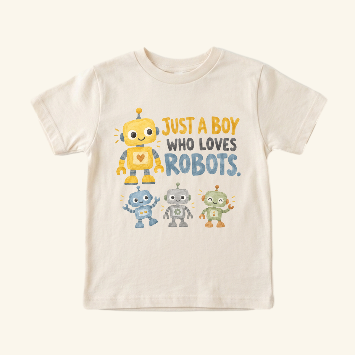 Light-colored Just a Boy Who Loves Robots Toddler Shirt featuring a graphic of four colorful robots and the text Just a boy who loves robots.