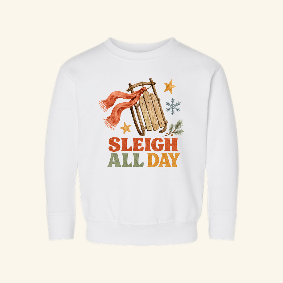 Sleigh All Day Toddler Sweatshirt featuring a vintage wooden sled, a red scarf, a snowflake, and two stars on a white background.