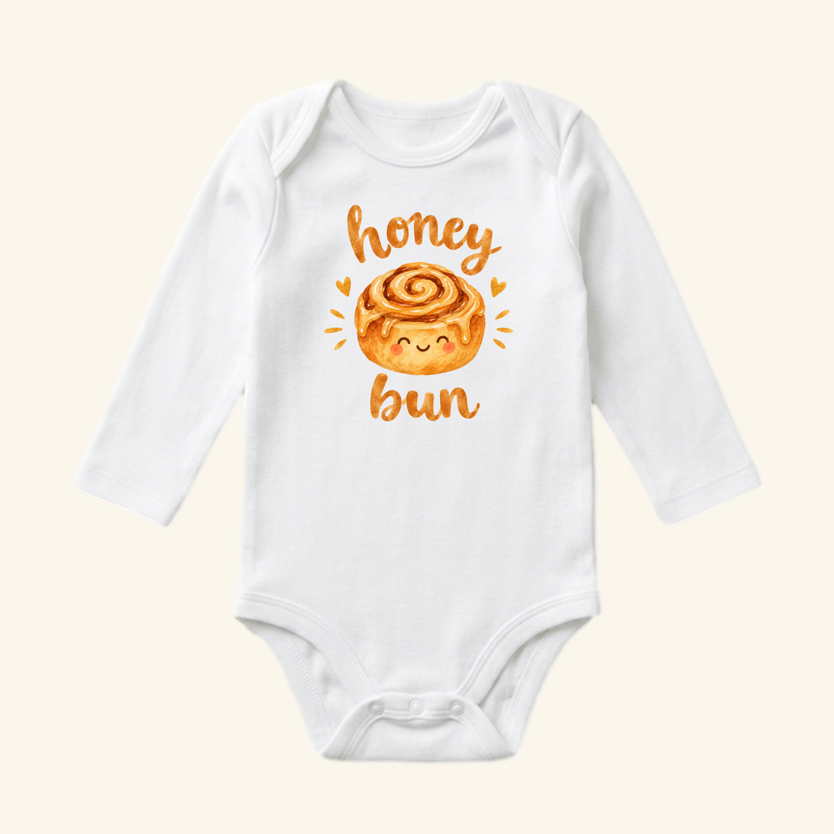 Toodleroos Cute Baby Onesie – Honey Bun Cinnamon Roll Bodysuit: white long-sleeve outfit with a smiling cinnamon roll and honey bun in orange script—perfect for your little one!.