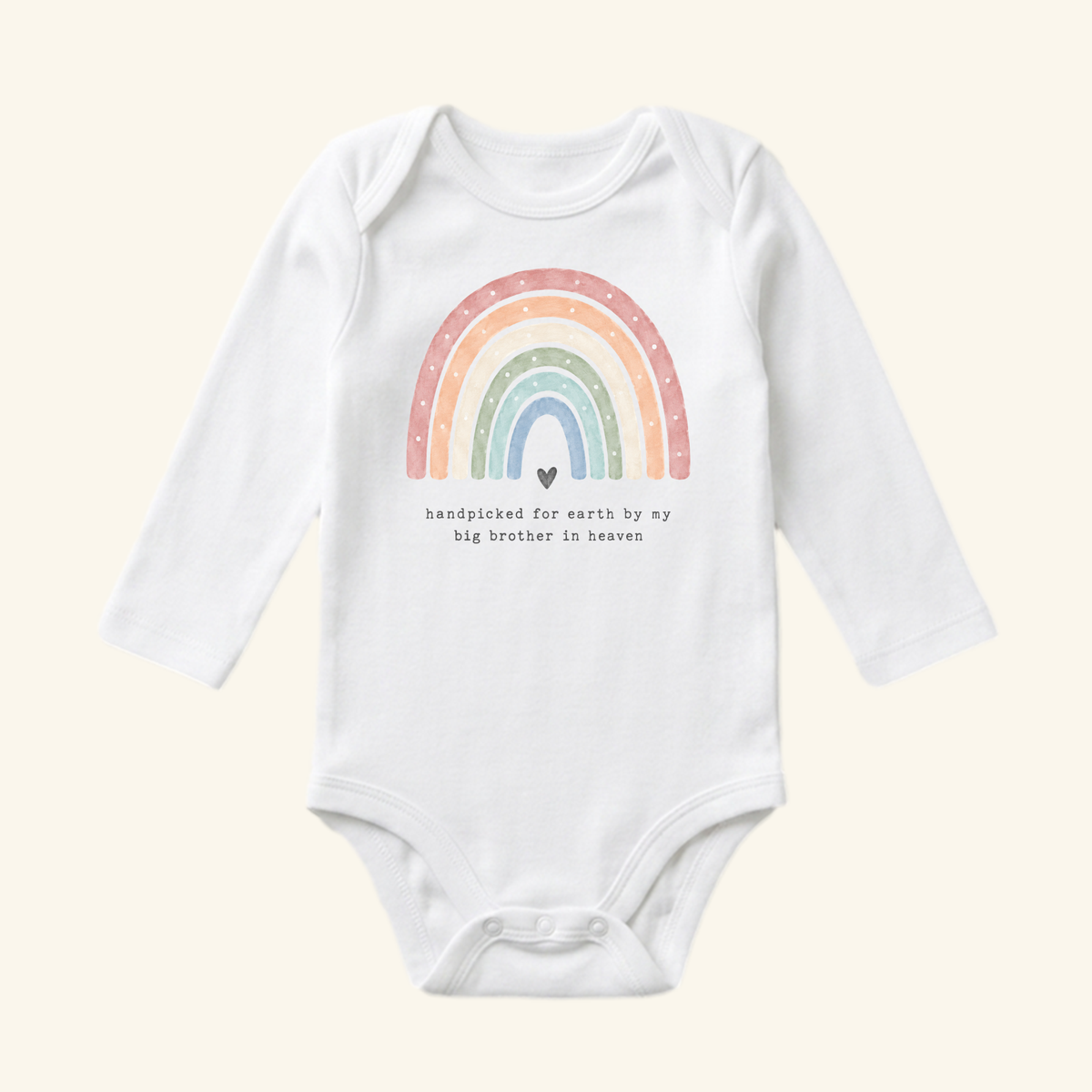 Toodleroos Rainbow Baby Onesie – Handpicked by My Big Brother in Heaven Bodysuit, featuring a white long-sleeve design with a watercolor rainbow graphic above a small heart and the text, handpicked for earth by my big brother in heaven.