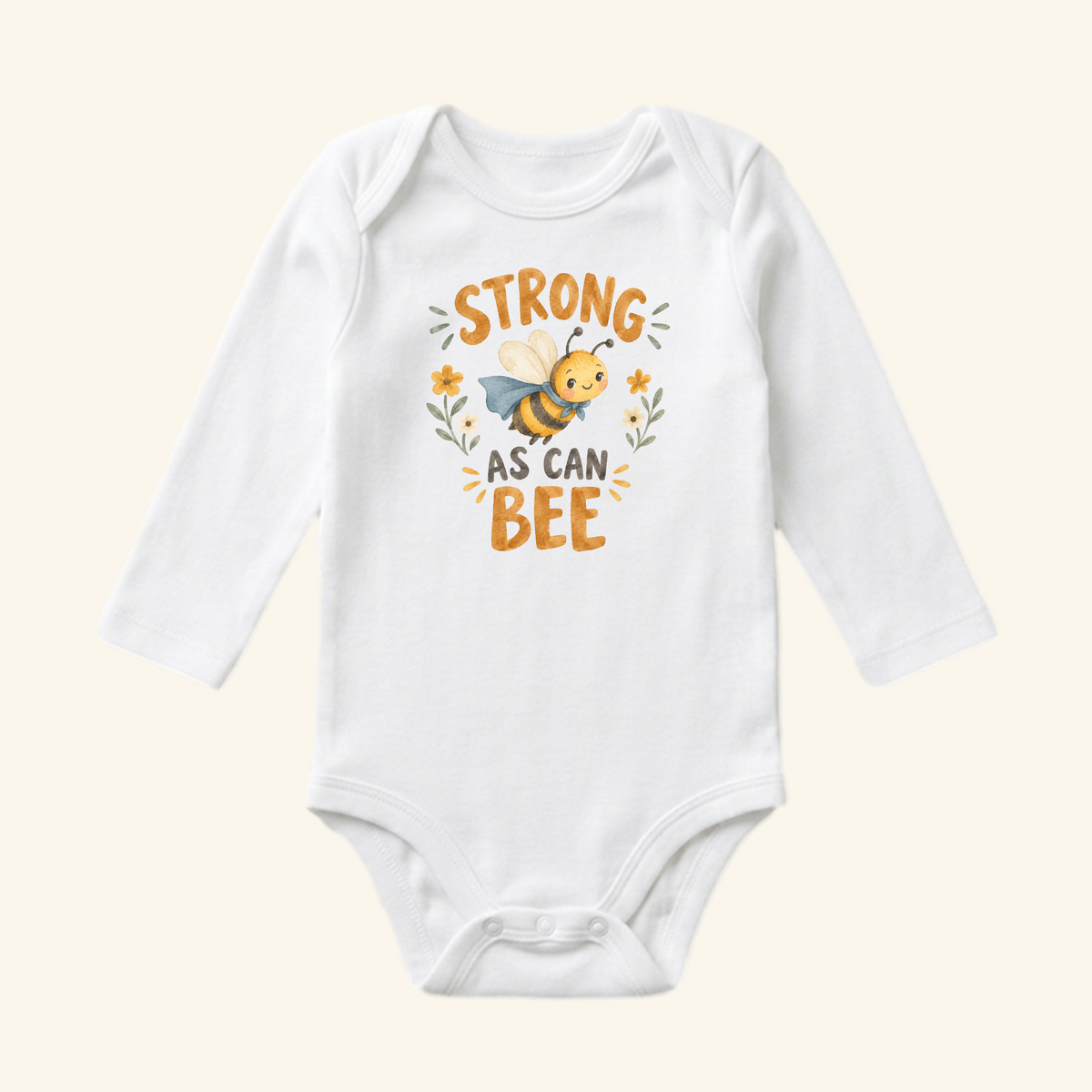 Toodleroos Strong As Can Bee Baby Onesie – Superhero Bee Bodysuit: white long-sleeve bodysuit featuring a graphic of a superhero bee and the text STRONG AS CAN BEE surrounded by small flowers.