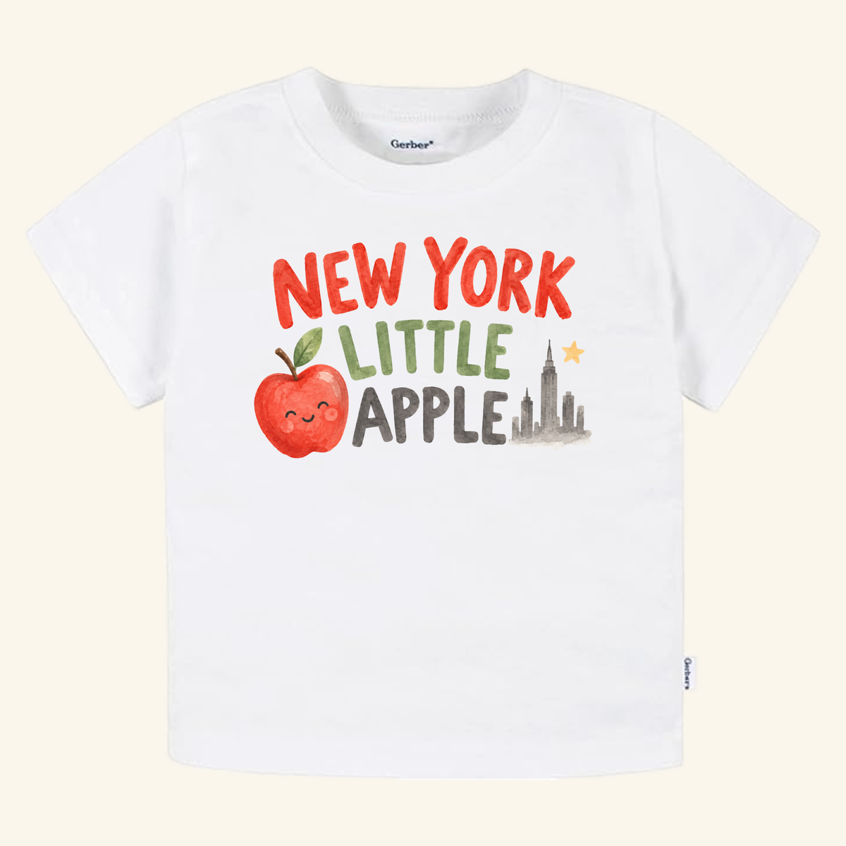 New York Toddler Shirt – Little Apple Skyline Watercolor Tee: a white toddler t-shirt featuring a watercolor graphic of a smiling apple and a city skyline.