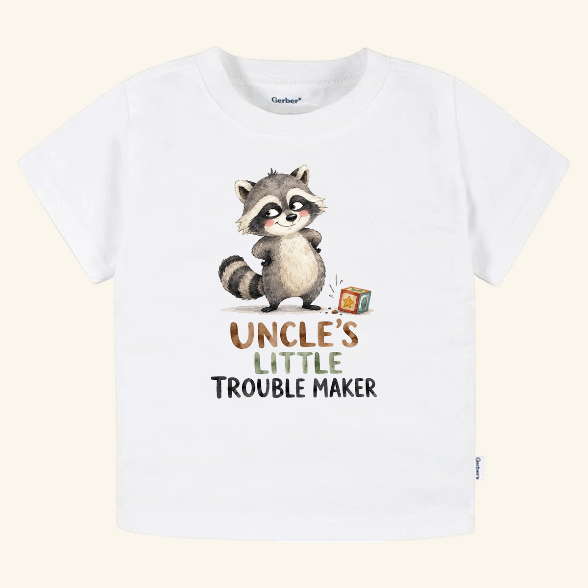 White toddler Toodleroos Funny Uncle Toddler Shirt – Uncle’s Little Troublemaker Tee featuring a watercolor illustration of a mischievous raccoon standing next to a toy block with the text Uncle’s Little Troublemaker printed below.
