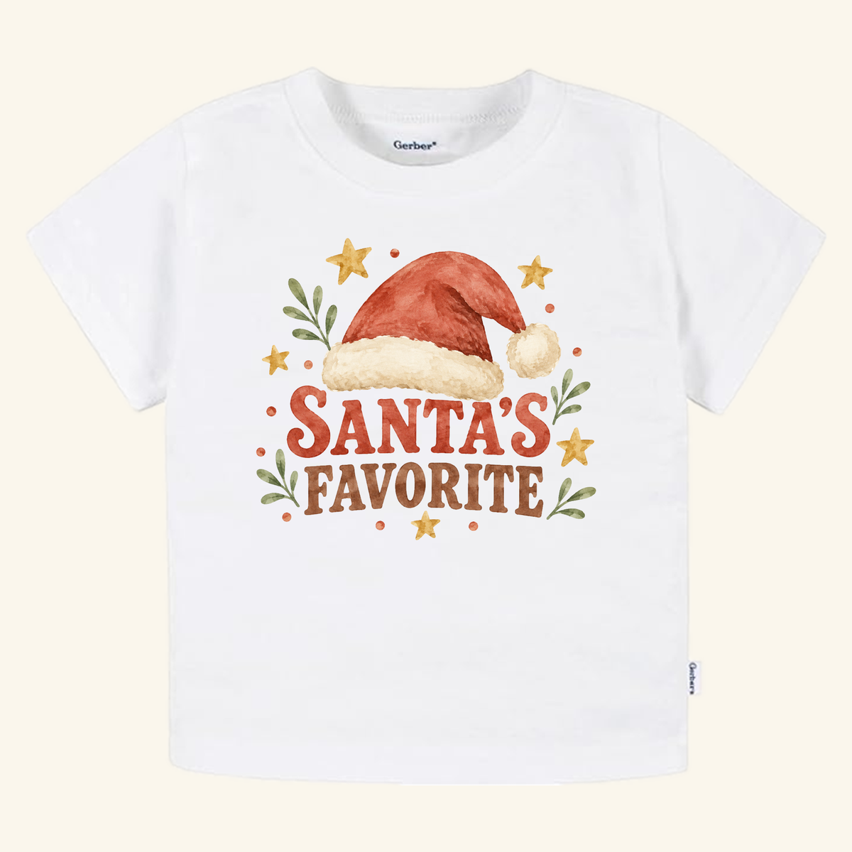 White Santa’s Favorite Toddler Shirt – Retro Christmas Santa Hat Tee featuring a watercolor illustration of a Santa hat, green leaves, and stars.