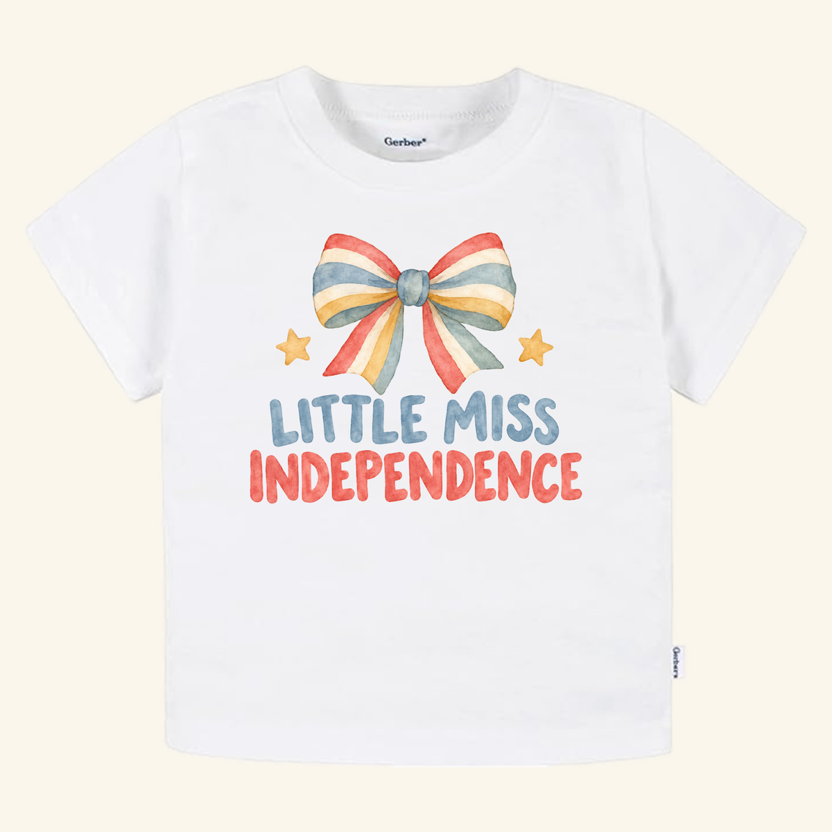 Little Miss Independence Toddler Shirt – Patriotic Bow Tee featuring a watercolor-style illustration of a red, white, and blue striped bow and two yellow stars with the text LITTLE MISS INDEPENDENCE.