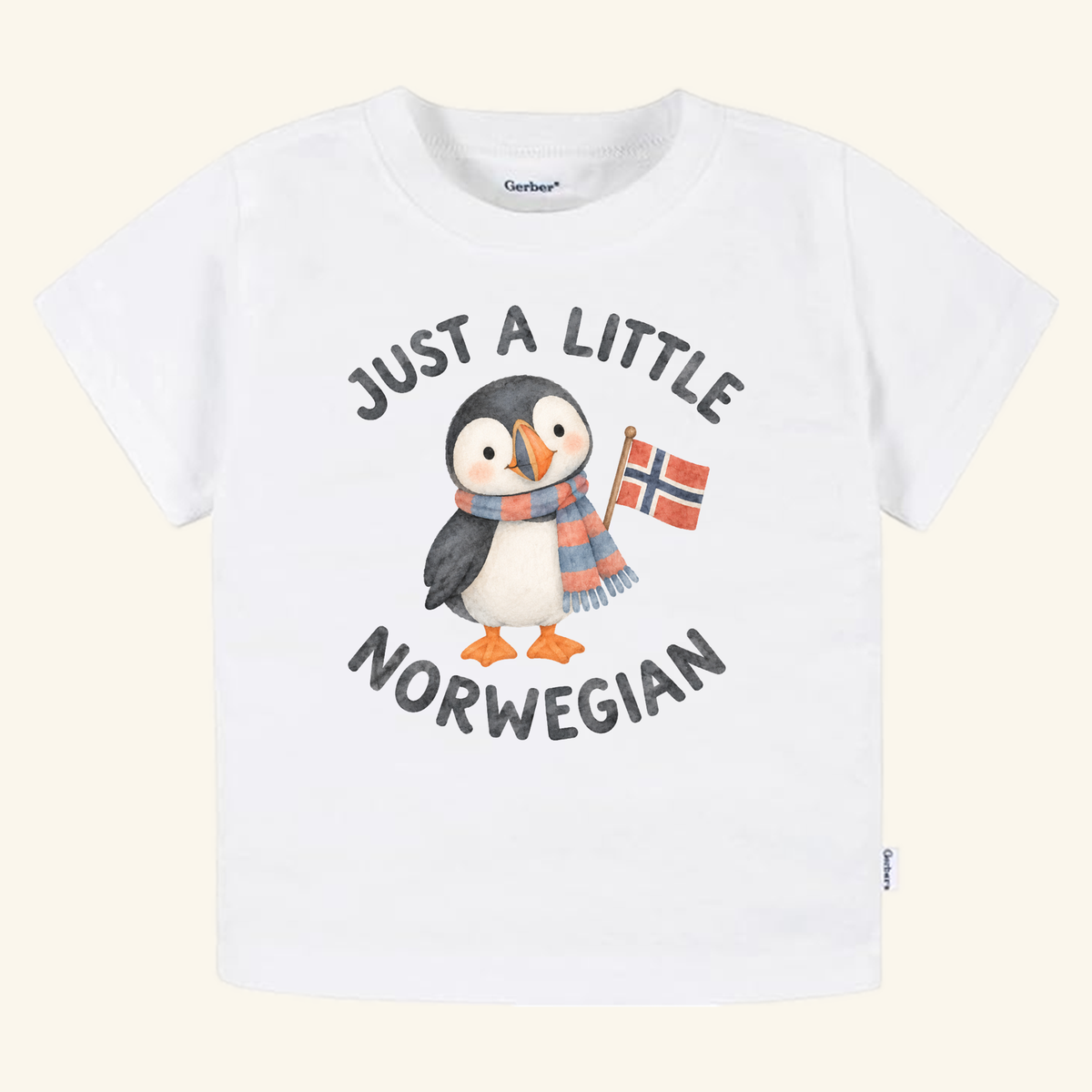 Just a Little Norwegian Toddler Shirt – Cute Puffin Norway Flag Tee featuring a white toddler t-shirt with a watercolor illustration of a puffin wearing a scarf and holding a Norwegian flag, with the text JUST A LITTLE NORWEGIAN printed around it.