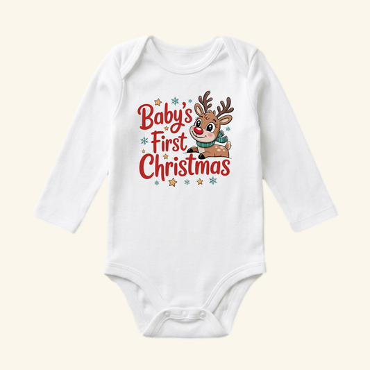 White long-sleeve Baby’s First Christmas Baby Onesie – Reindeer Holiday Bodysuit featuring a reindeer graphic, snowflakes, and stars.