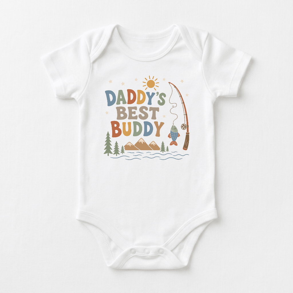 Dress your little one for adventure in the Toodleroos Baby Boy Fishing Onesie – Daddy’s Best Buddy Short-Sleeve Bodysuit, featuring charming illustrations of a fishing rod, fish, water, trees, mountains, and a sun alongside the playful “Daddy’s Best Buddy” text. This adorable white bodysuit is perfect for families who love the great outdoors and makes a wonderful choice for your baby boy’s next bonding trip with dad!.