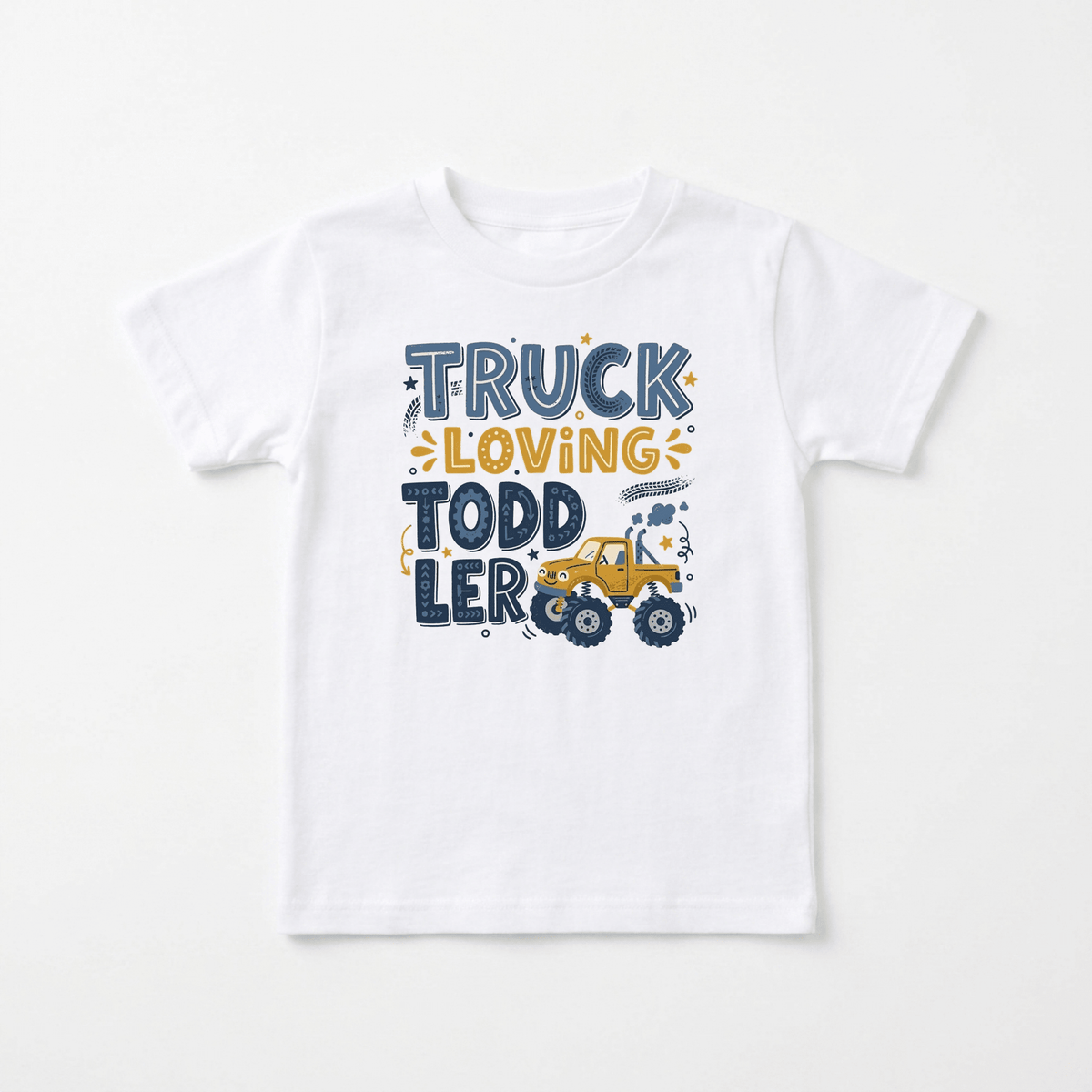 The Toodleroos Truck Loving Toddler Boys Shirt – Monster Truck Tee is a white toddler t-shirt featuring the words “Truck Loving Toddler” in blue and yellow, with a fun cartoon monster truck illustration below “Loving.” This playful boys shirt is perfect for any young monster truck fan.