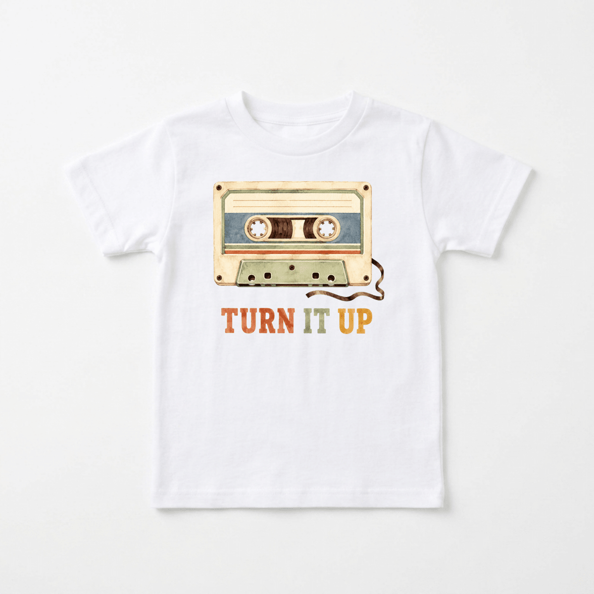 The Toodleroos Toddler Music Shirt – Turn It Up Retro Cassette Graphic Tee showcases a cassette tape design above vibrant, bold “TURN IT UP” lettering. With its vintage-inspired style, this graphic tee is a fun addition to any toddler’s music-themed wardrobe.