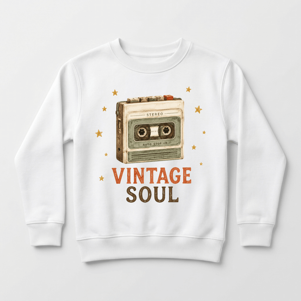 The Toddler Music Sweatshirt – Vintage Soul Retro Cassette Pullover by Toodleroos is a white sweatshirt featuring a retro cassette tape illustration surrounded by small stars, with “VINTAGE SOUL” printed below in bold orange and brown letters.