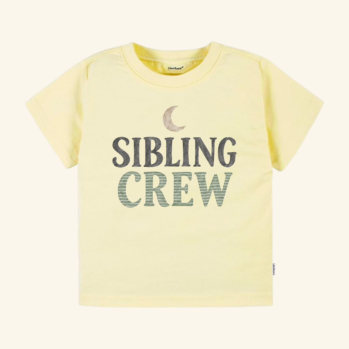 Light yellow Sibling Crew Toddler Shirt featuring a crescent moon graphic above the words SIBLING CREW, a perfect gender-neutral toddler shirt.