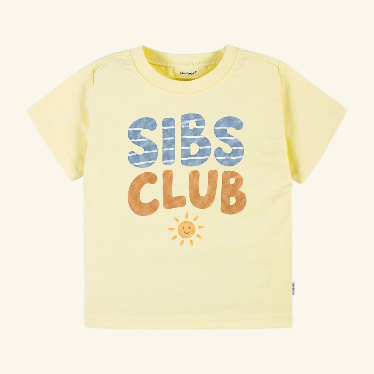 Pale yellow short-sleeved Sibs Club Toddler Shirt – Matching Sibling Smiley Sun Tee featuring the words SIBS CLUB and a small smiling sun graphic on the chest.