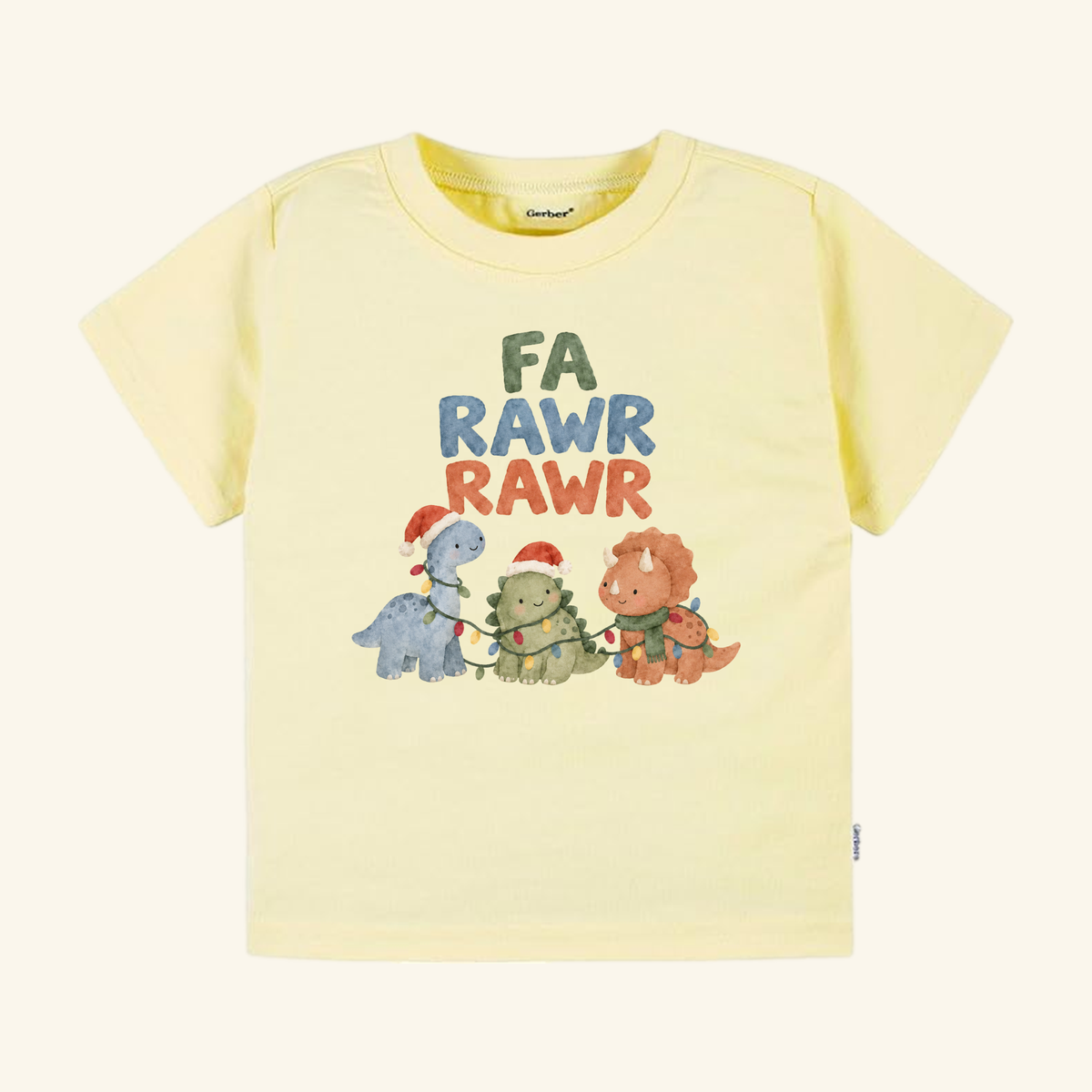 Pale yellow Fa Rawr Rawr Toddler Shirt featuring three dinosaurs wearing holiday hats and scarves, tangled in Christmas lights, with the text FA RAWR RAWR above them.