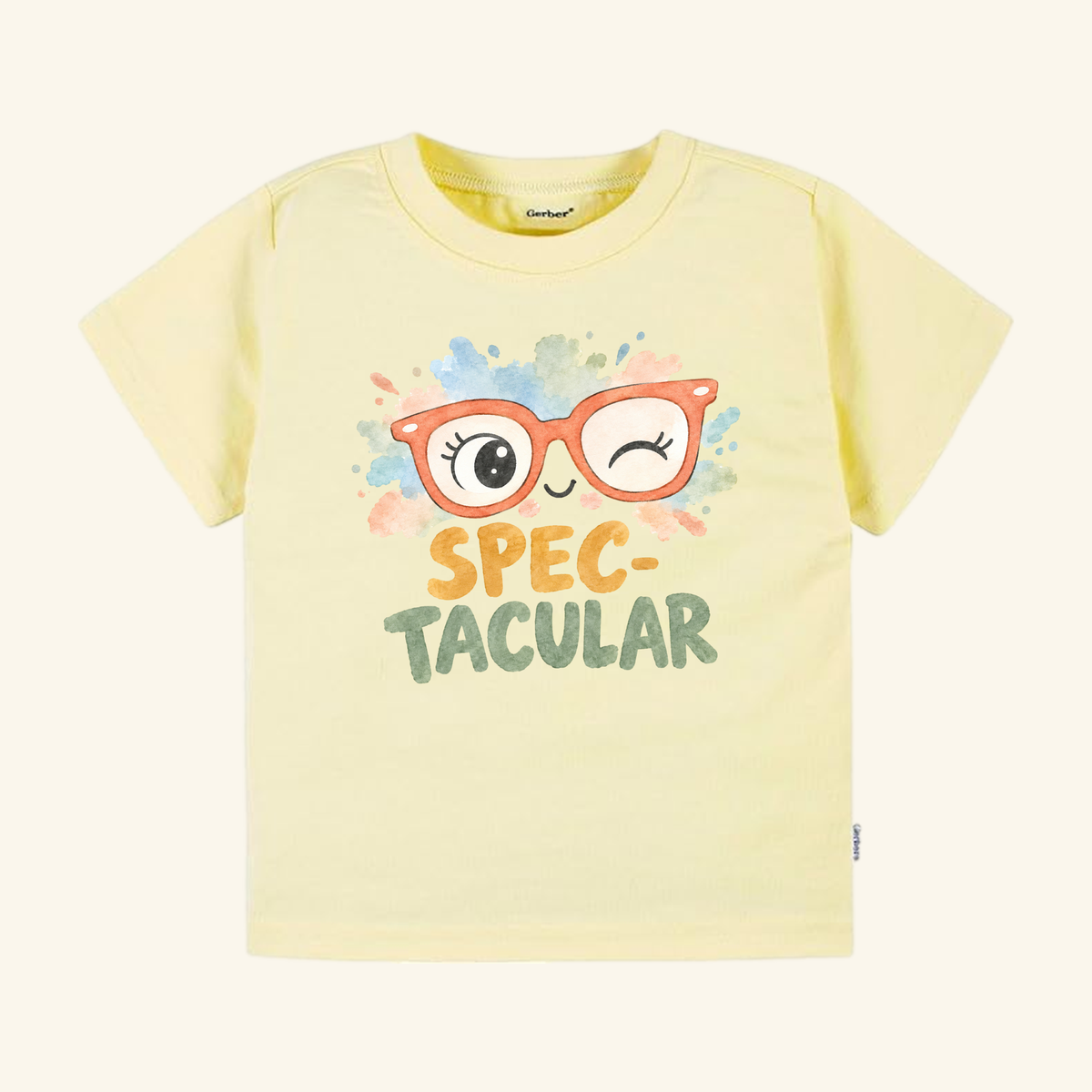 Spec-tacular Toddler Shirt – Cute Winking Glasses Tee in pale yellow featuring a confidence-boosting graphic of orange winking glasses above the text SPEC-TACULAR.