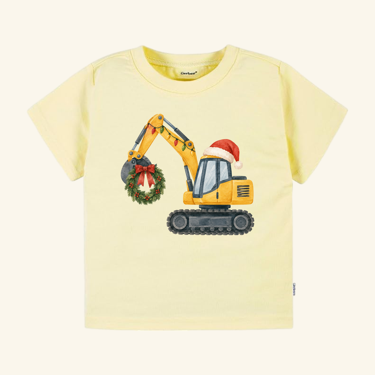 Toodleroos Christmas Excavator Toddler Shirt featuring a light yellow t-shirt with a yellow excavator wearing a Santa hat, draped in Christmas lights, and holding a holiday wreath.