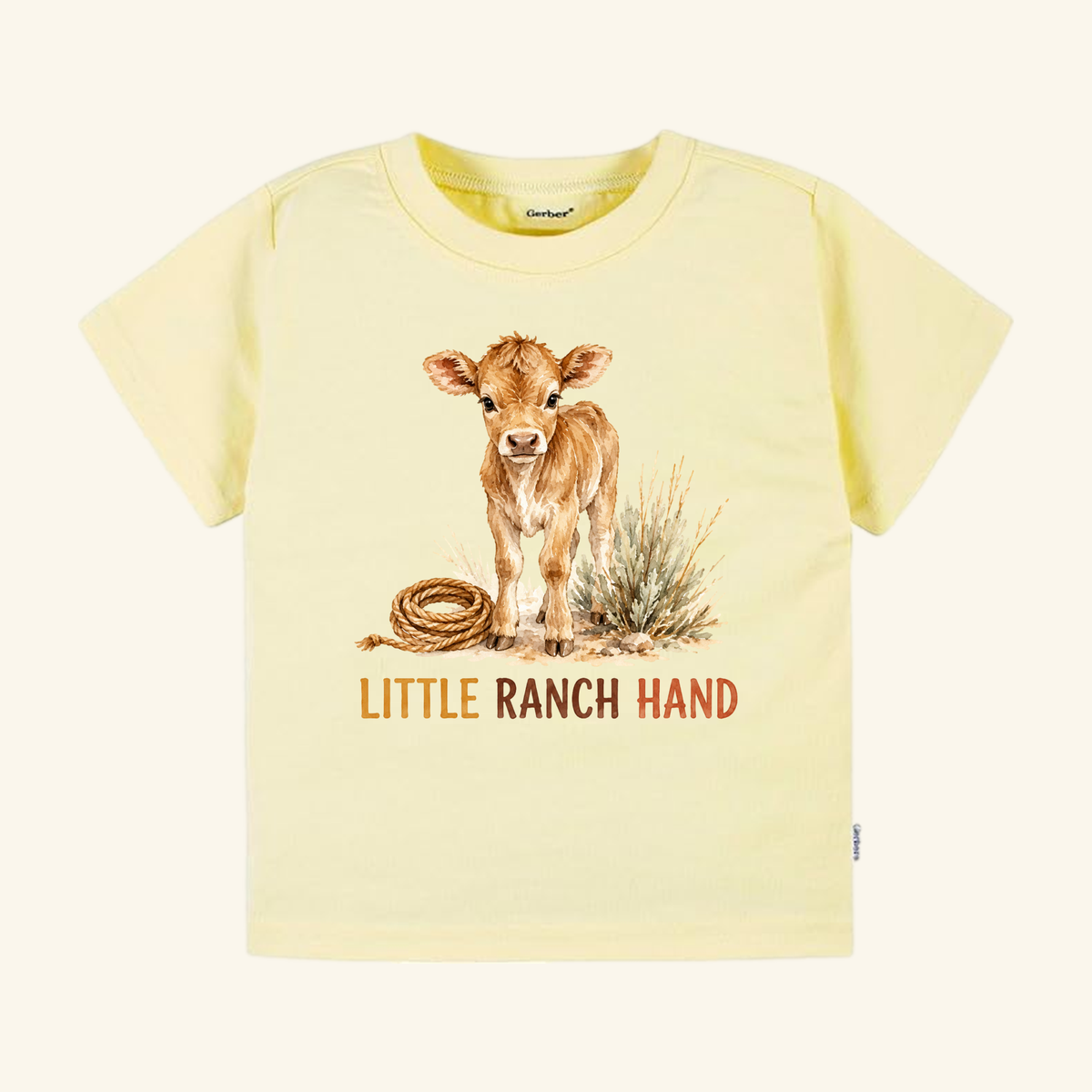 Light yellow Little Ranch Hand Toddler Shirt – Western Baby Calf Country Tee featuring a watercolor illustration of a calf, a coiled rope, and the text LITTLE RANCH HAND.