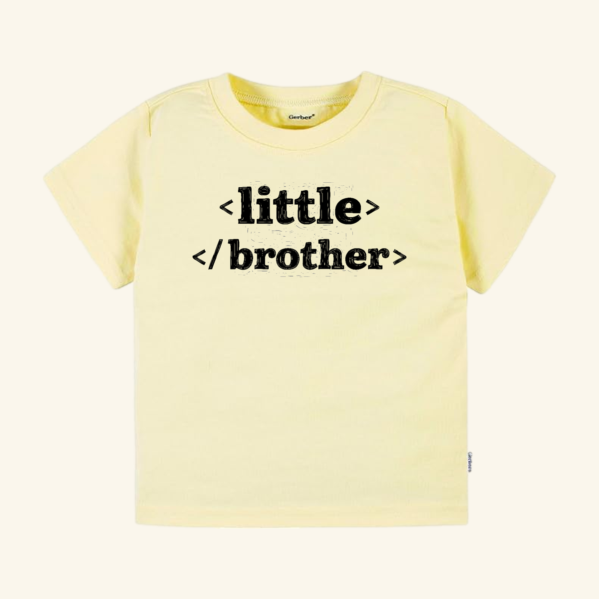 Pale yellow Toodleroos Little Brother Toddler Shirt – HTML Code Sibling Announcement Tee with black HTML code text that reads <little> </brother>.