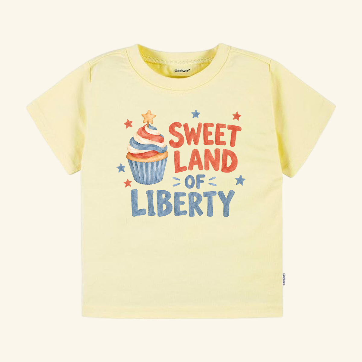 Pale yellow Sweet Land of Liberty Toddler Shirt – Patriotic Cupcake Tee featuring a red, white, and blue cupcake graphic with the text Sweet Land of Liberty.