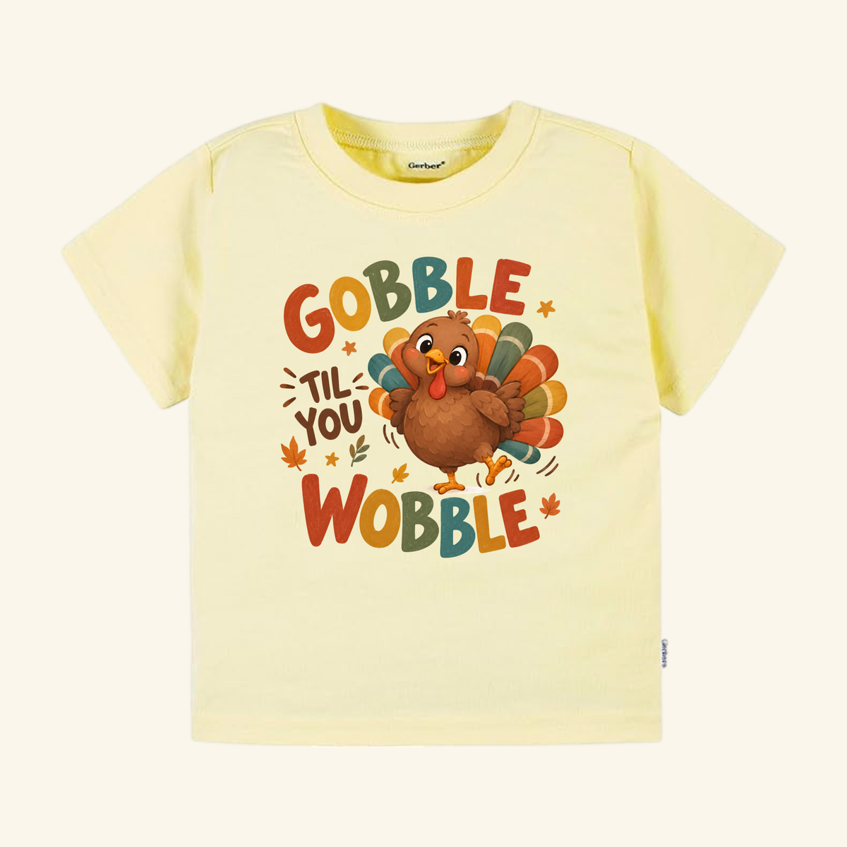 Light yellow toddler Gobble Til You Wobble Toddler Thanksgiving Shirt – Funny Turkey Tee featuring a cartoon turkey and the text Gobble til you wobble.