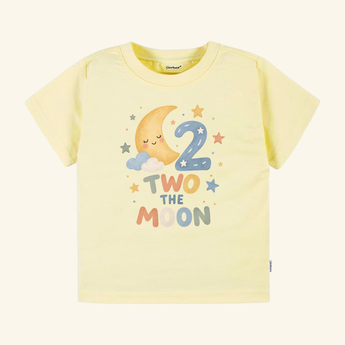 Two the Moon 2nd Birthday Toddler Shirt featuring a pale yellow tee with a watercolor graphic of a crescent moon, clouds, stars, and the number two, with the text TWO THE MOON printed below.