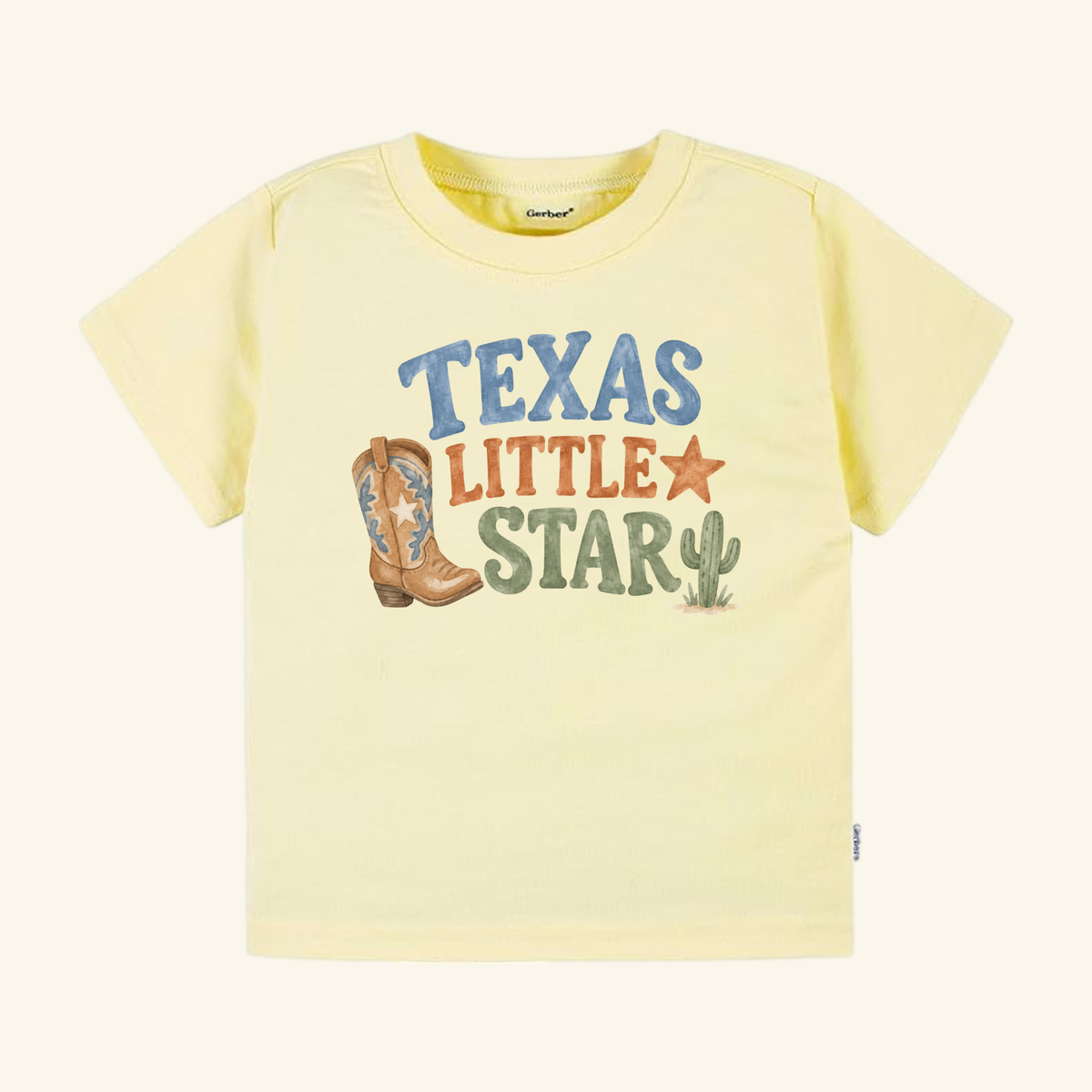 Pale yellow Texas Toddler Shirt – Little Star Cowboy Boot Western Tee featuring a cowboy boot, a cactus, a star, and the text TEXAS LITTLE STAR.