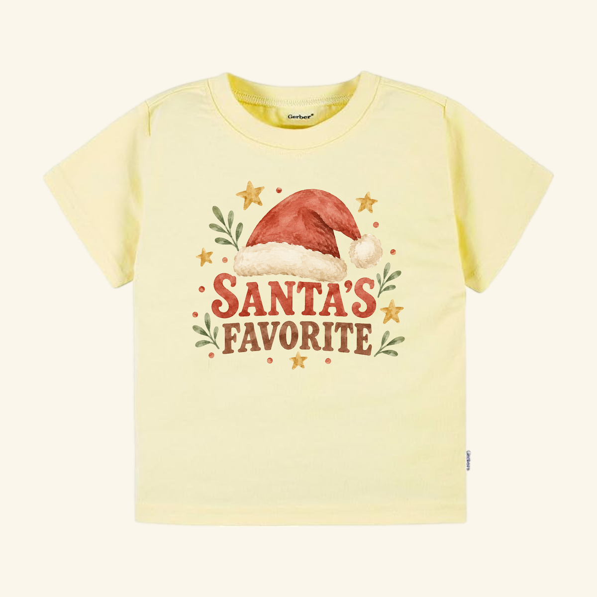 Light yellow Santa’s Favorite Toddler Shirt – Retro Christmas Santa Hat Tee featuring a watercolor illustration of a Santa hat, stars, and greenery, with the text Santa’s Favorite printed underneath.