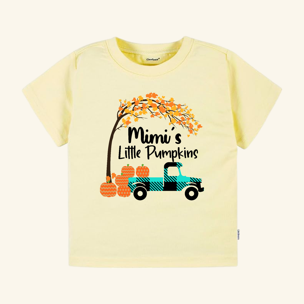 Mimi’s Little Pumpkins Toddler Shirt featuring a light yellow t-shirt with a teal plaid truck carrying pumpkins under an autumn tree and the text Mimi’s Little Pumpkins in a farmhouse pumpkin patch design.