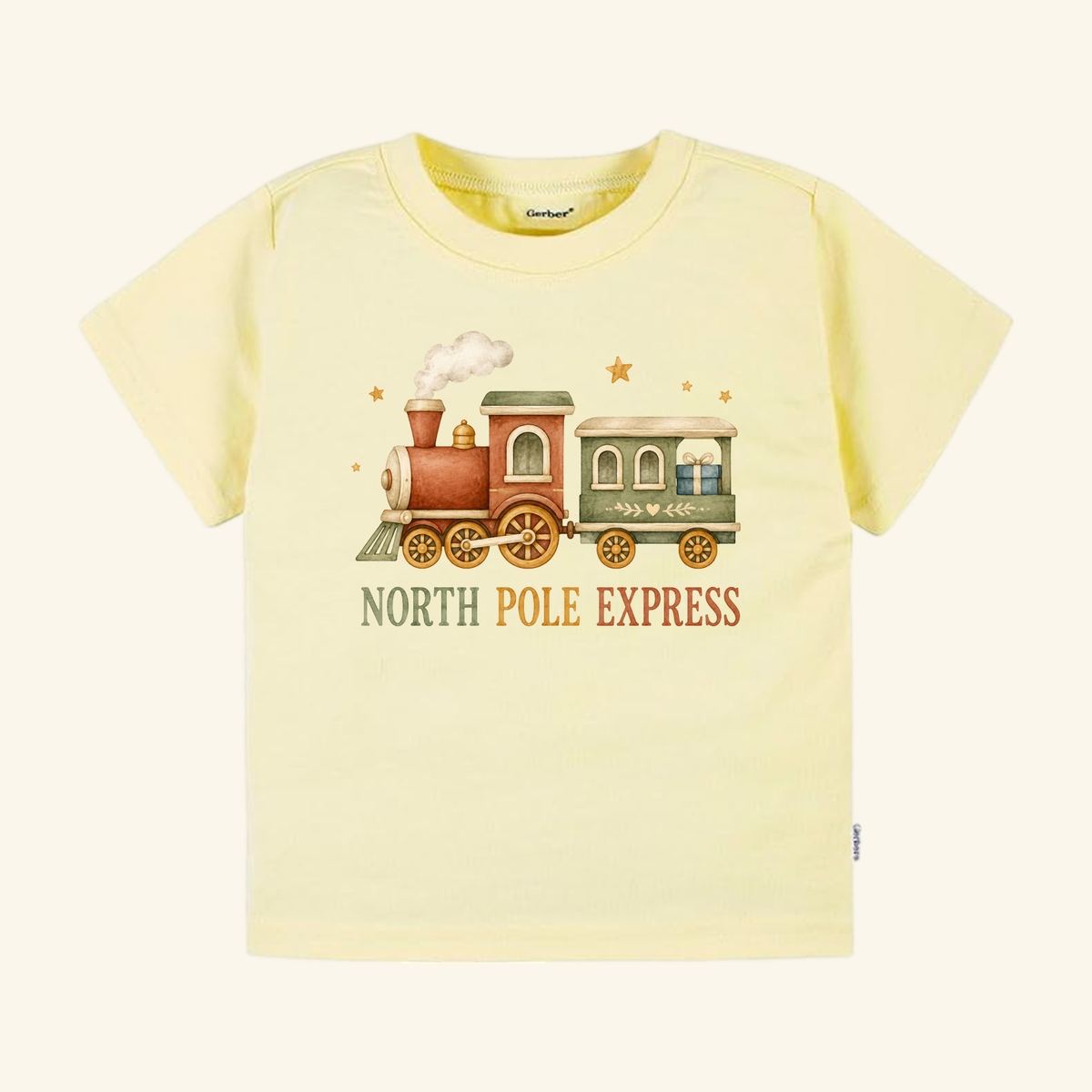 Pale yellow North Pole Express Toddler Shirt – Vintage Christmas Train Tee featuring a vintage Christmas train illustration carrying a gift, with the North Pole Express printed underneath.