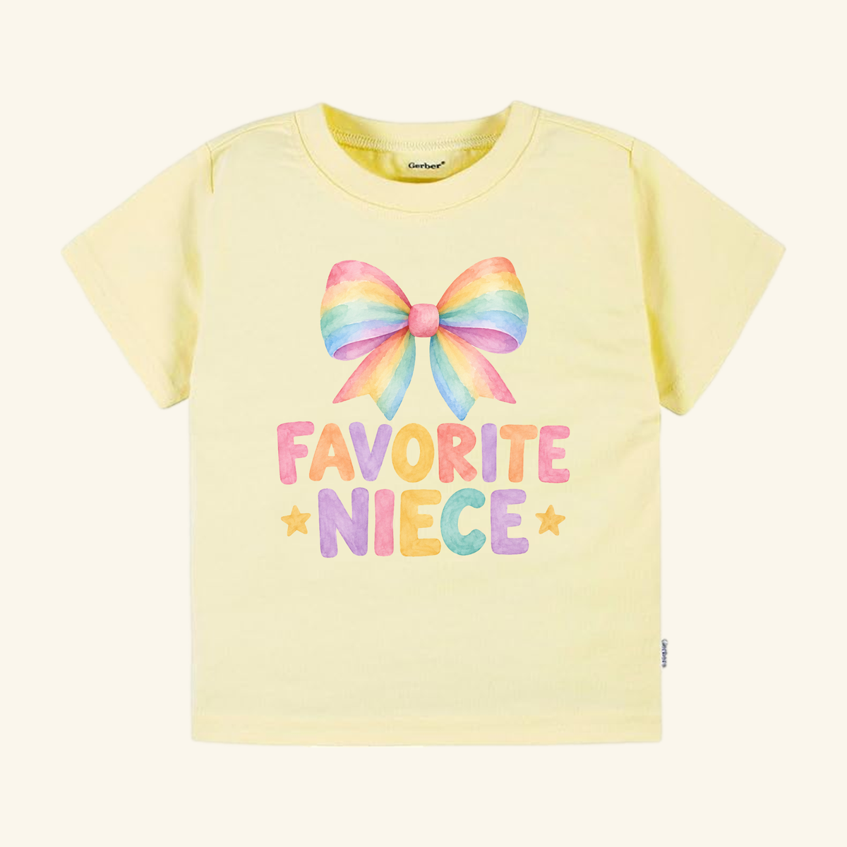 Pale yellow Favorite Niece Toddler Shirt – Cute Rainbow Bow Tee featuring a watercolor rainbow bow above the text FAVORITE NIECE with a star on either side in a coquette style.