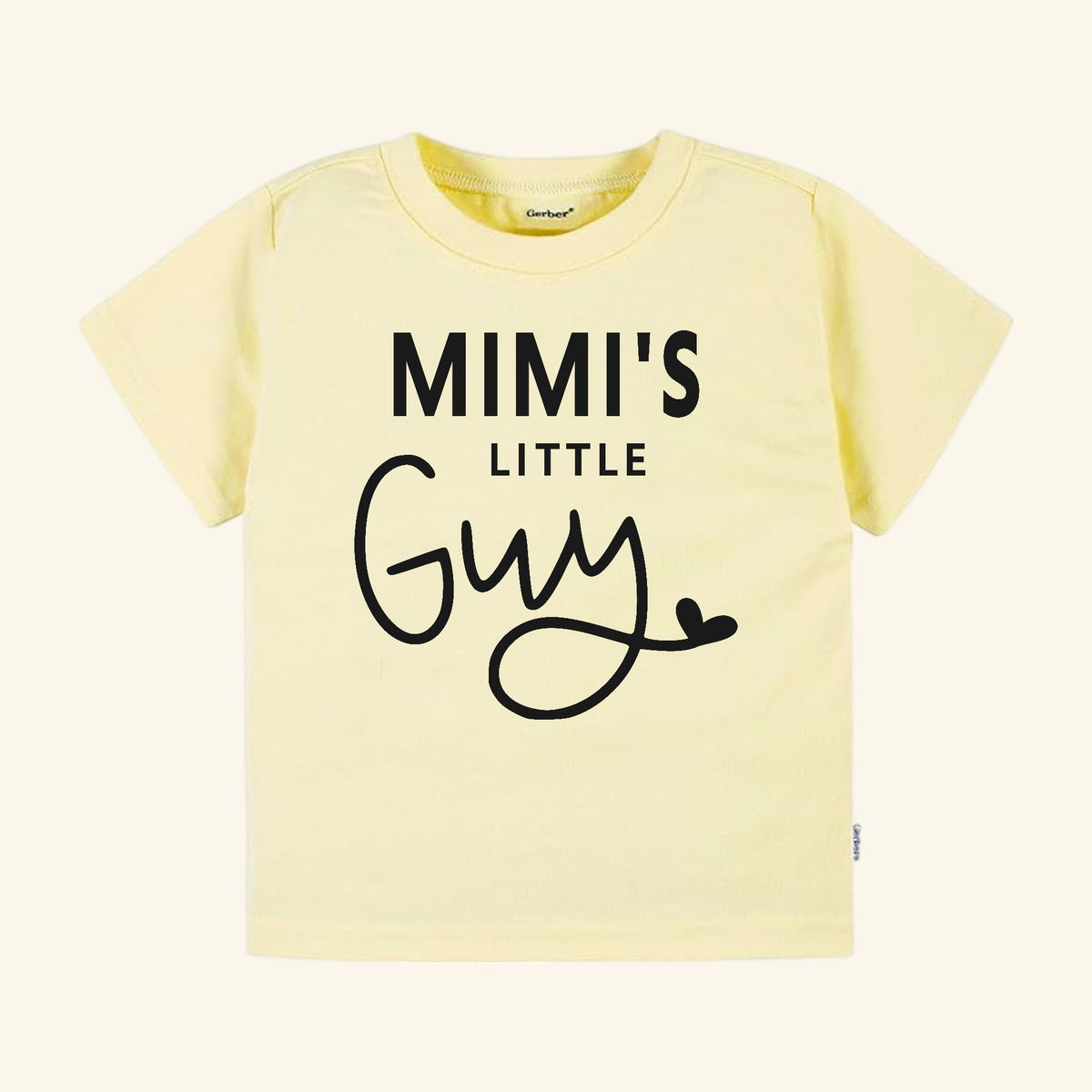 Pale yellow Mimi Toddler Shirt – Mimi’s Little Guy Tee with Mimi’s Little Guy printed in black on the front.