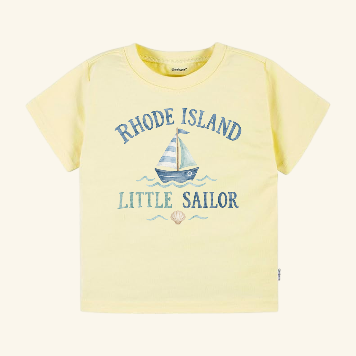 Toodleroos Rhode Island Toddler Shirt – Little Sailor Sailboat Tee in pale yellow, featuring a blue sailboat graphic with Rhode Island above and Little Sailor below, finished with a small seashell at the bottom.