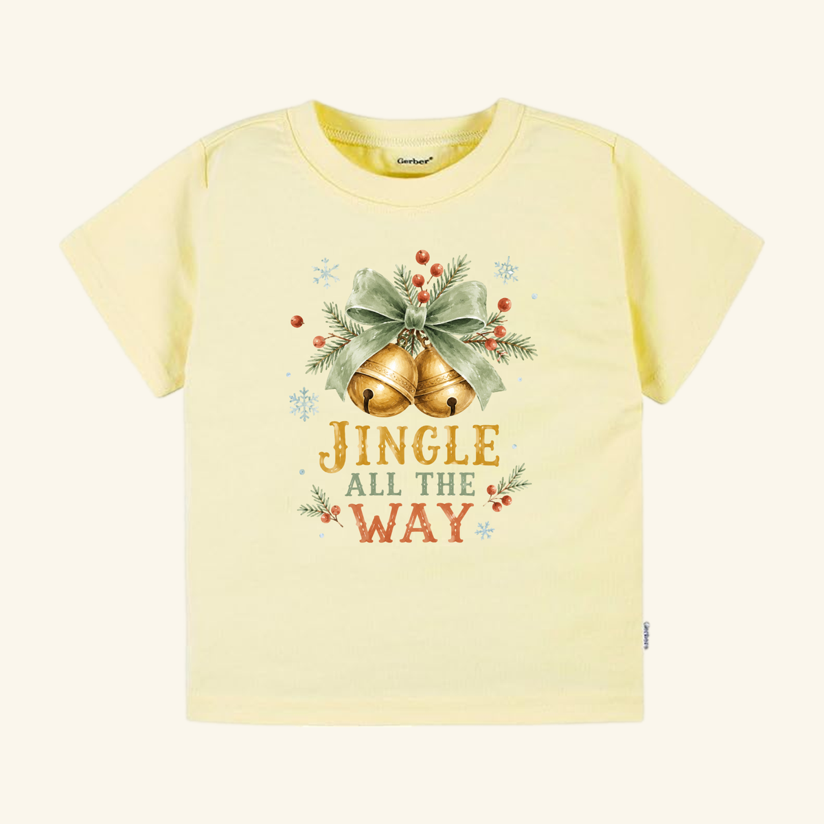 Pale yellow Jingle All the Way Toddler Shirt – Vintage Christmas Jingle Bells Tee featuring a vintage holiday graphic of two golden bells tied with a green ribbon and sprigs of holly, with the text JINGLE ALL THE WAY below.