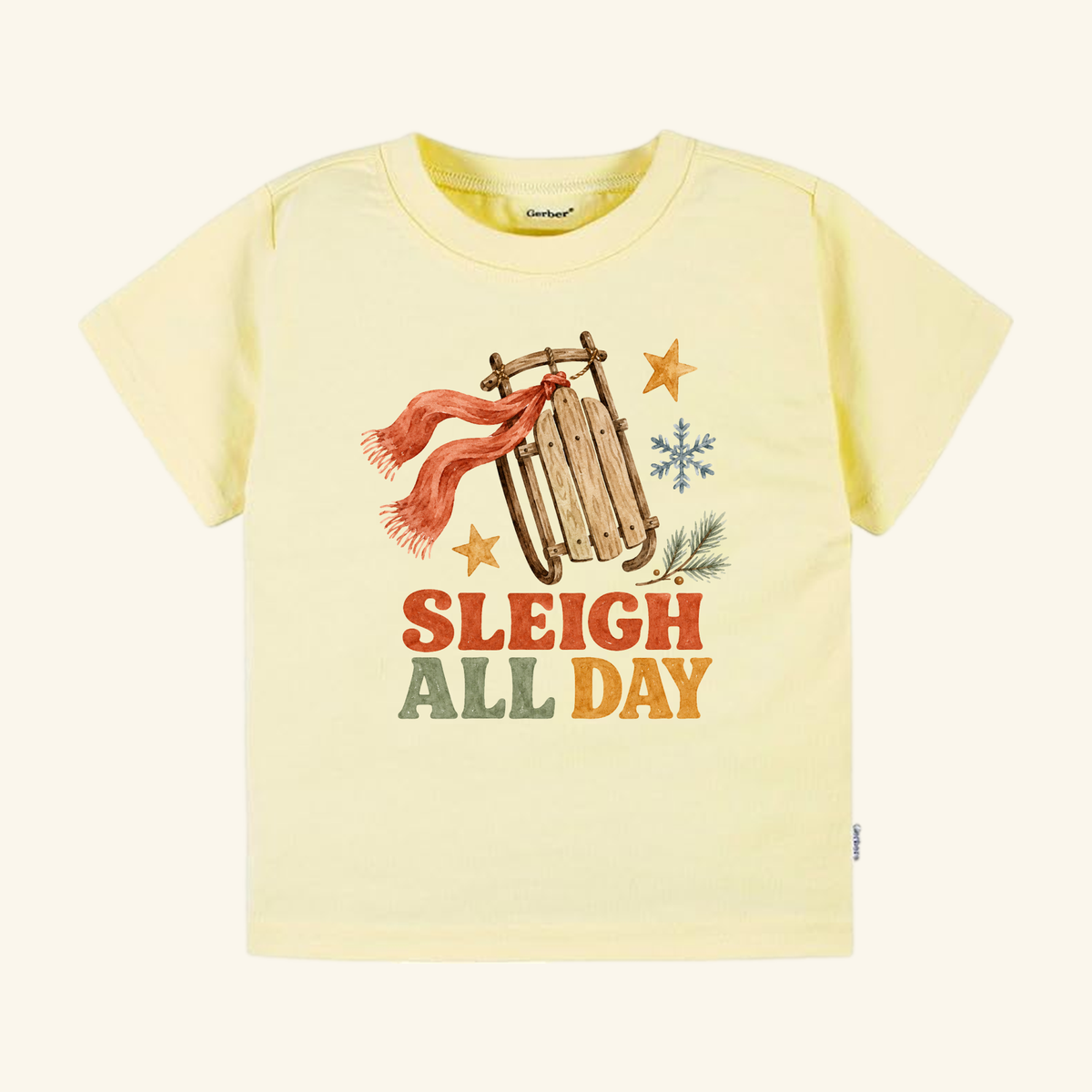 A pale yellow Sleigh All Day Toddler Shirt – Retro Christmas Sled Tee featuring a retro Christmas sled, a red scarf, snowflakes, and stars with the text SLEIGH ALL DAY.