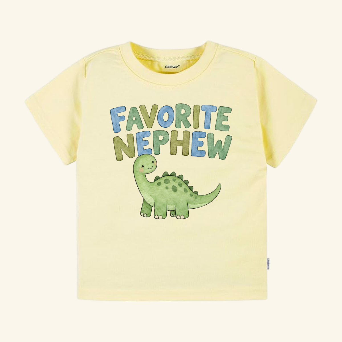 Favorite Nephew Toddler Shirt – Cute Dinosaur Aunt & Uncle Gift Tee in pale yellow, featuring a cartoon green dinosaur and the text FAVORITE NEPHEW in blue and green letters.