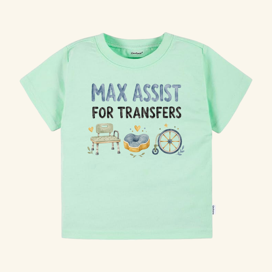 Mint green Max Assist for Transfers Toddler Shirt – Funny PT & OT Tee featuring the text MAX ASSIST FOR TRANSFERS above watercolor illustrations of a shower chair, a cushioned seat, and a wheelchair wheel.