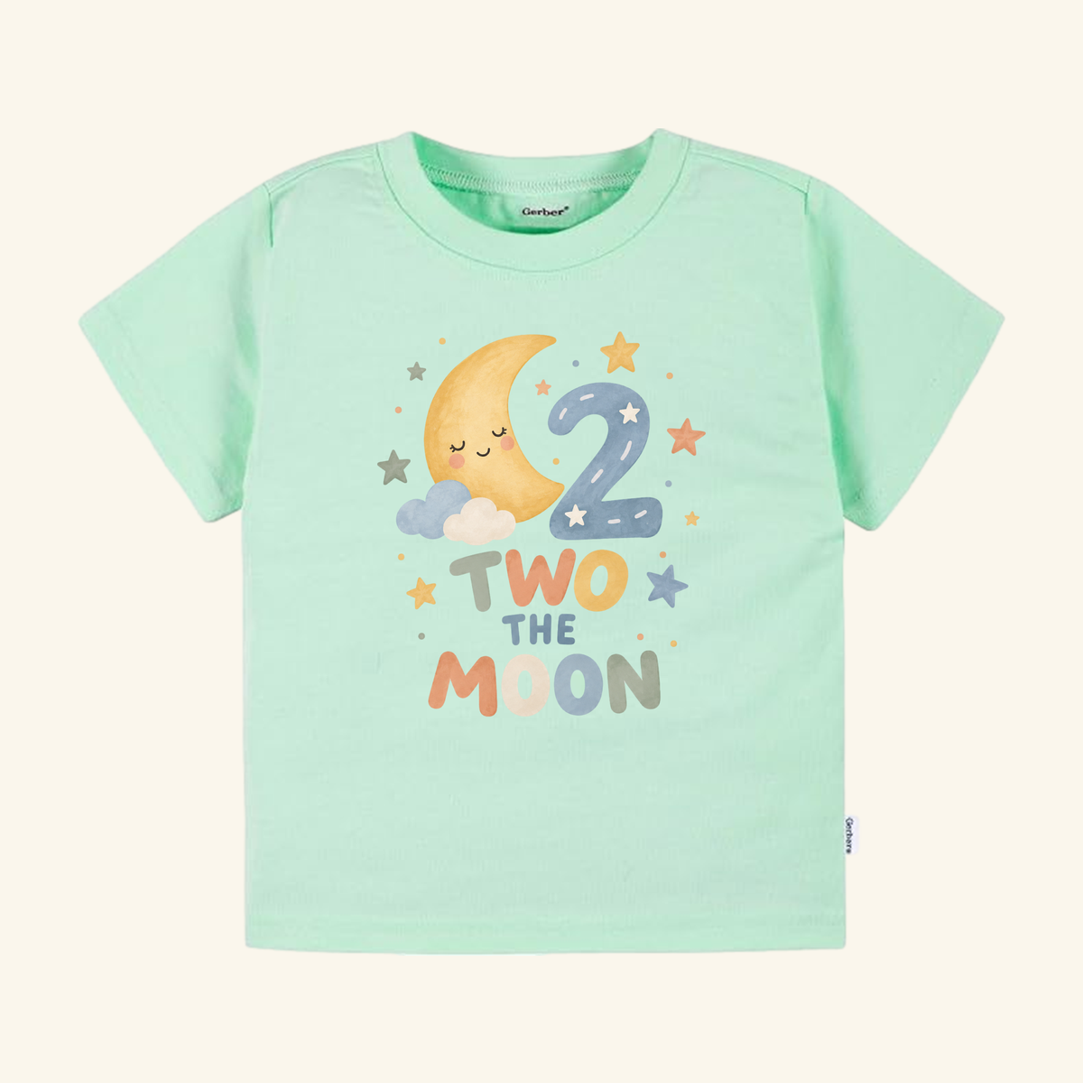 Mint green Two the Moon 2nd Birthday Toddler Shirt featuring a watercolor graphic of a smiling crescent moon, the number 2, stars, and clouds.
