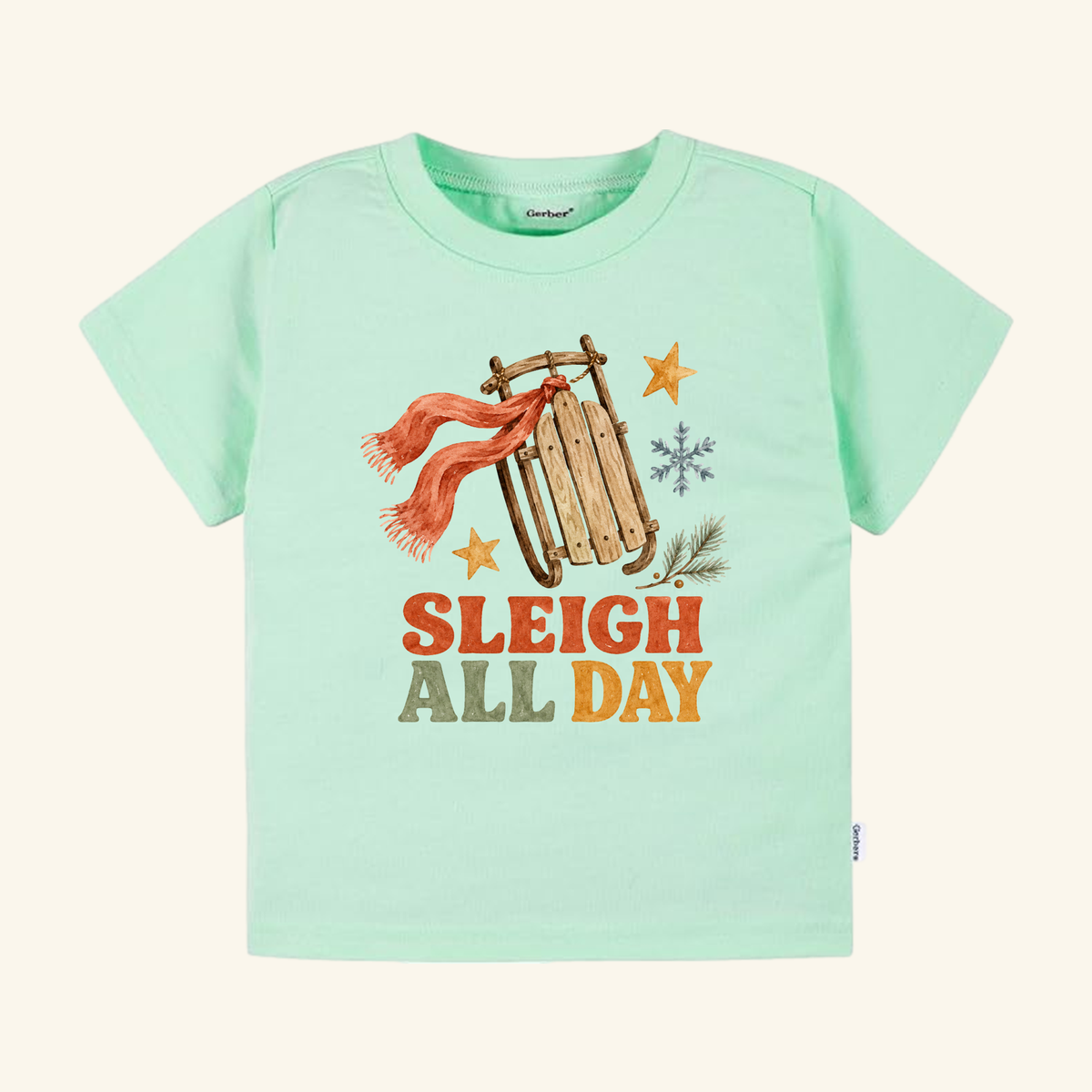 Light green Sleigh All Day Toddler Shirt – Retro Christmas Sled Tee featuring a retro Christmas sled with a red scarf, surrounded by stars and snowflakes.