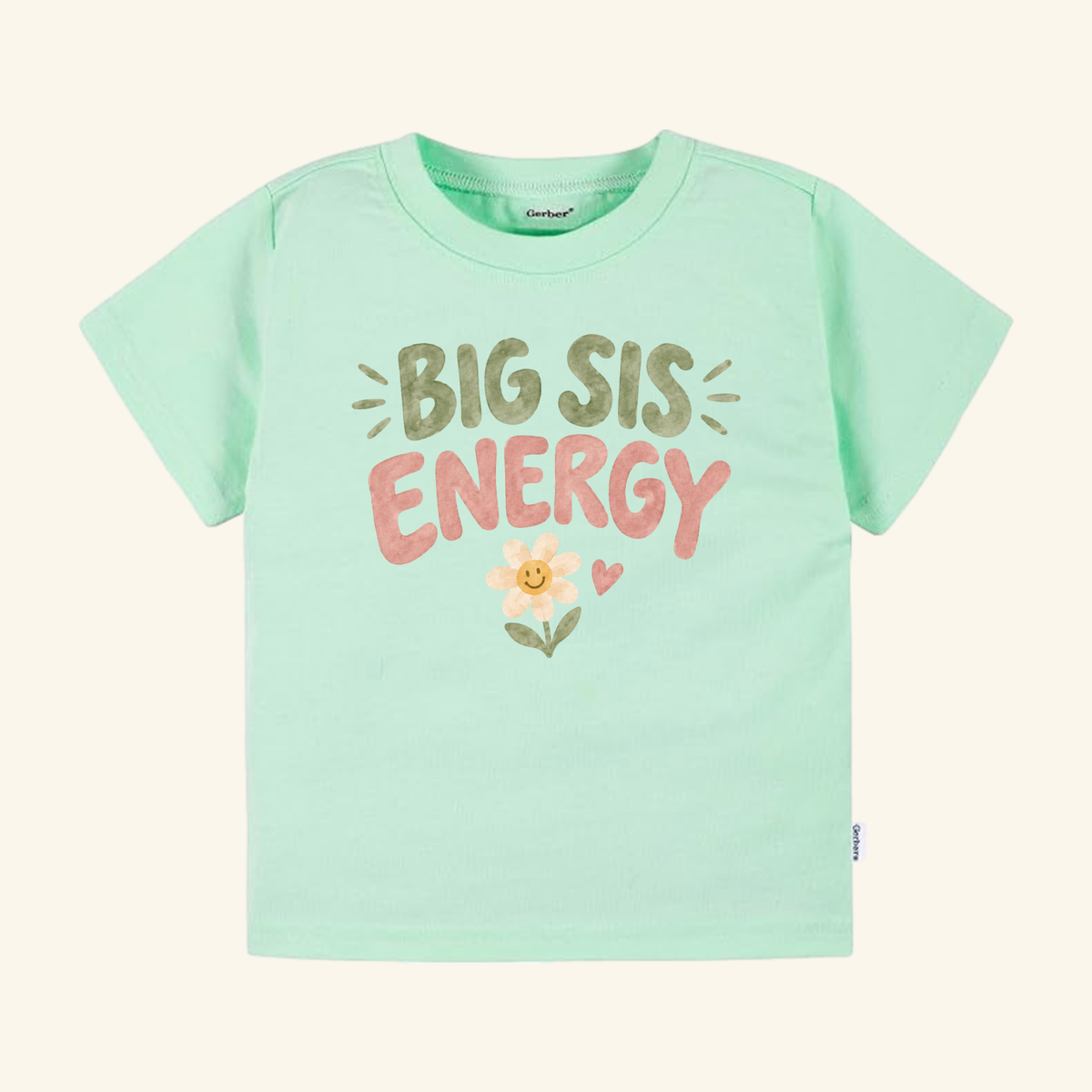Mint green Big Sis Energy Toddler Shirt – Smiley Daisy Sibling Tee featuring BIG SIS ENERGY in pink and olive green text above a smiling daisy graphic.