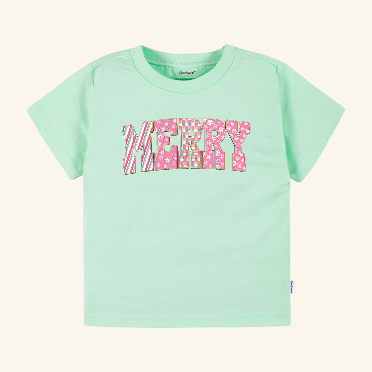 Light green Merry Toddler Shirt – Pink Candy Cane Christmas Tee with MERRY printed on the front in festive holiday patterns of pink and white.