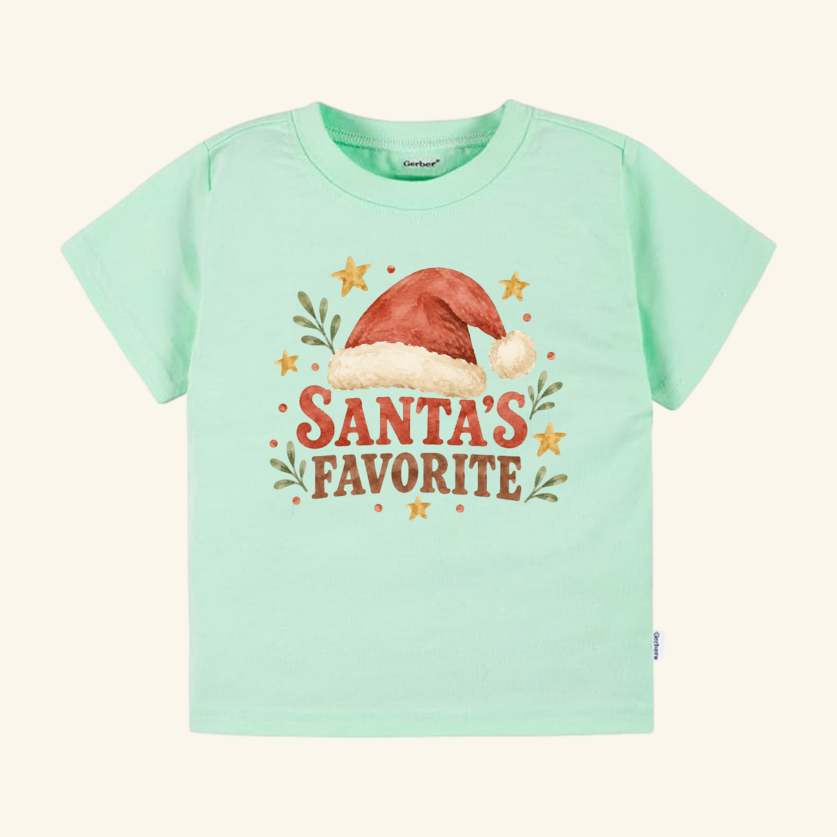 Mint green Santa’s Favorite Toddler Shirt – Retro Christmas Santa Hat Tee featuring a Santa hat, greenery, stars, and the text Santa’s Favorite.