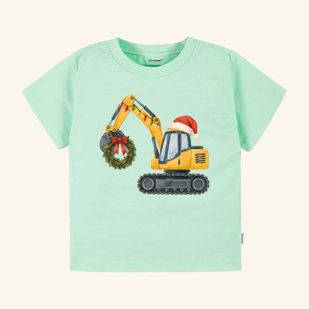 Light green Christmas Excavator Toddler Shirt featuring a yellow excavator wearing a Santa hat and holding a Christmas wreath with string lights for a festive holiday construction tee.