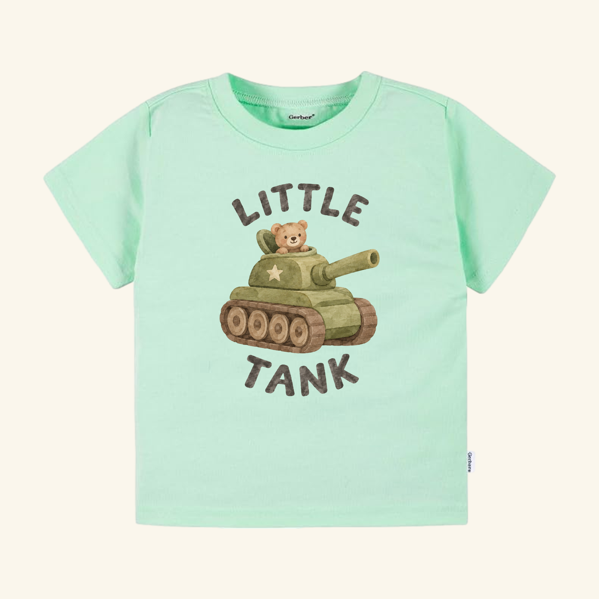 Light green Little Tank Toddler Shirt featuring a watercolor-style illustration of a teddy bear inside a toy army tank, with the text LITTLE TANK printed above and below the design.