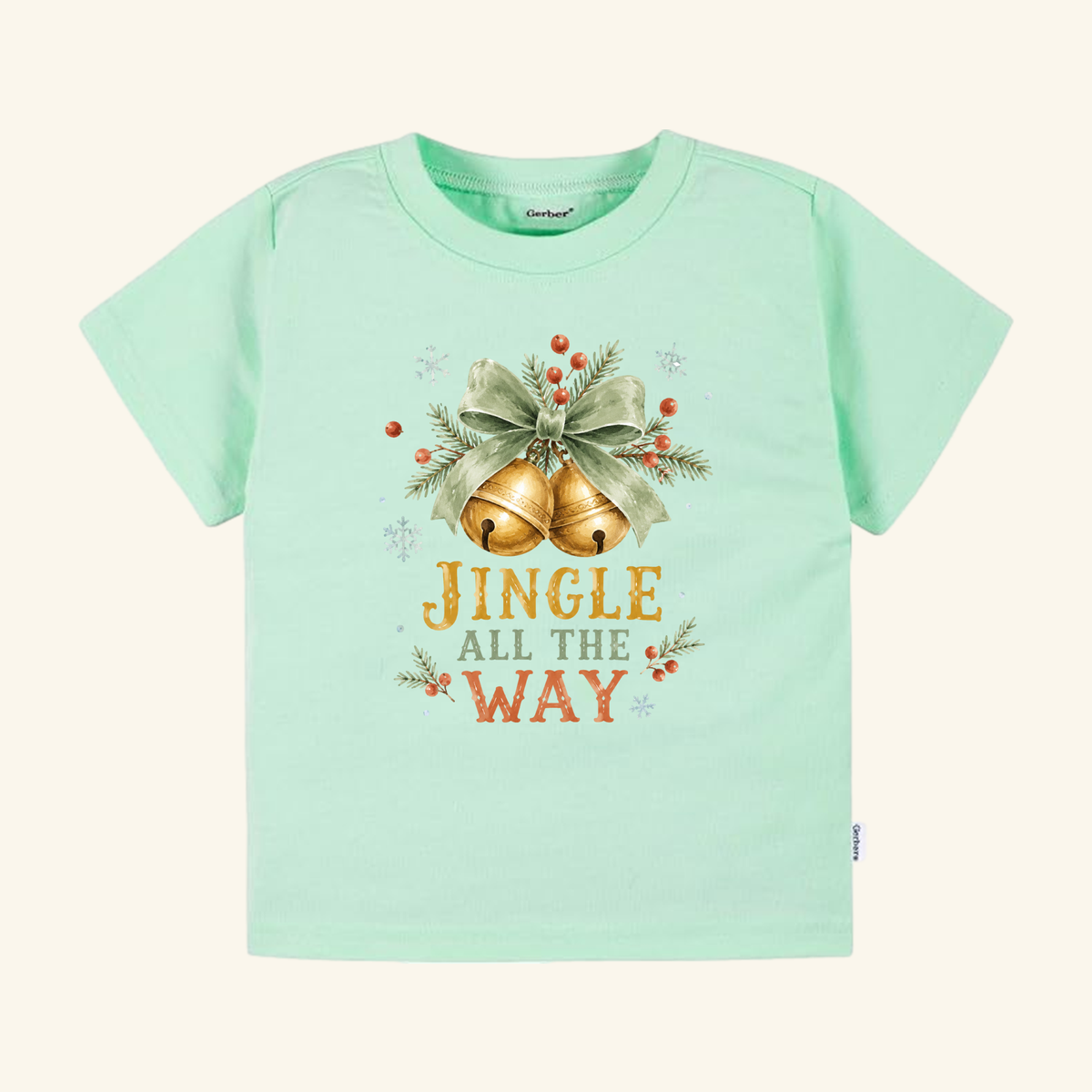 Light green Jingle All the Way Toddler Shirt featuring a vintage holiday design of two gold bells, a bow, holly berries, and the text JINGLE ALL THE WAY.