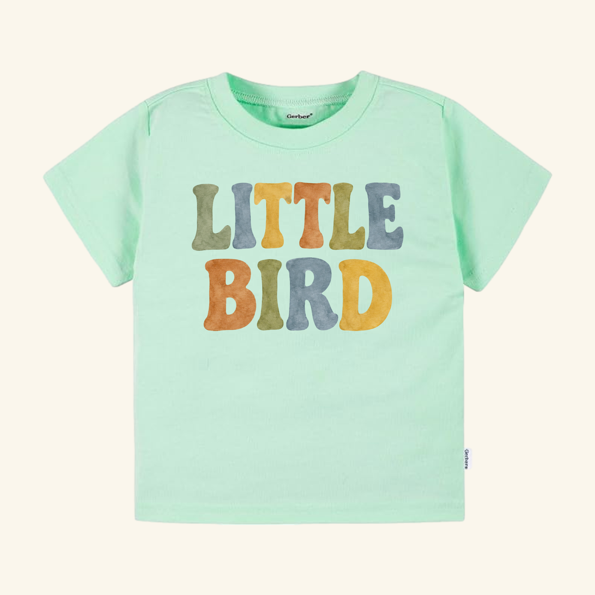 Little Bird Toddler Shirt – Retro Watercolor Lettering Tee in mint green with LITTLE BIRD printed in colorful, retro watercolor lettering.