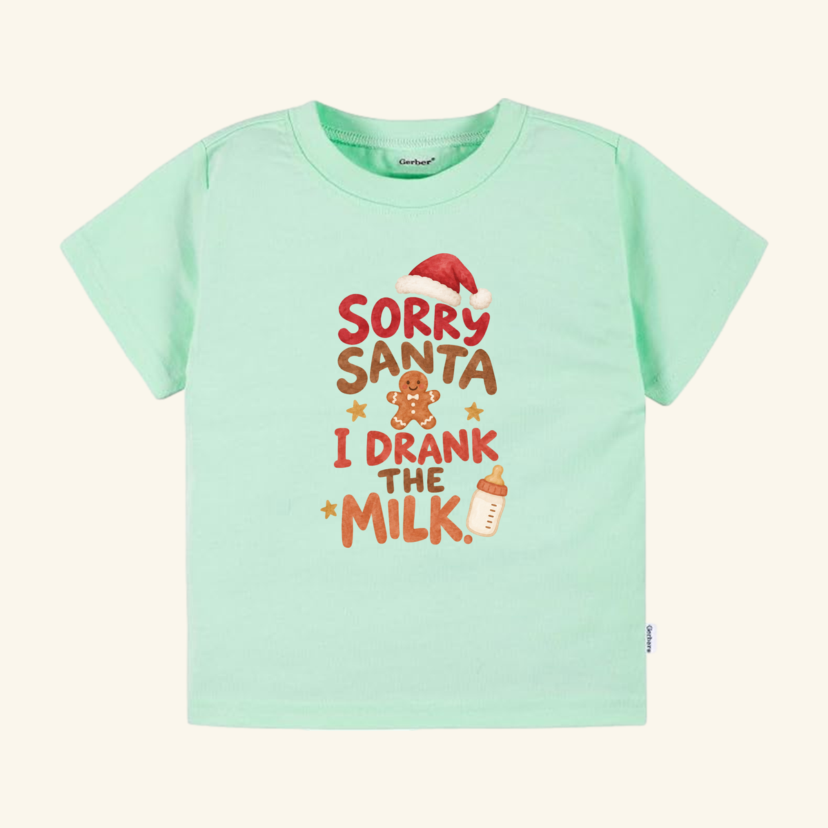 Mint green Sorry Santa I Drank the Milk Toddler Shirt – Funny Christmas Tee featuring a Santa hat, a gingerbread man, and a baby bottle.