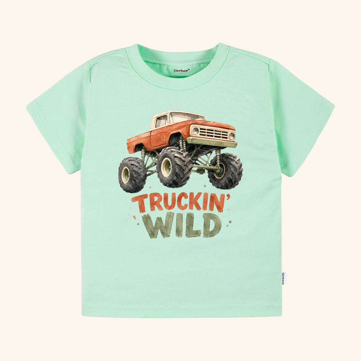 Mint green Monster Truck Toddler Shirt – Truckin’ Wild Short-Sleeve Tee featuring a watercolor monster truck graphic with the text TRUCKIN WILD underneath.