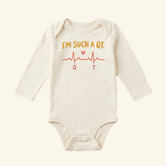 I’m Such a QT Baby Onesie – Funny EKG Heartbeat Nurse Bodysuit featuring an EKG heartbeat line, a small heart, and the text IM SUCH A QT. on a long-sleeve bodysuit.