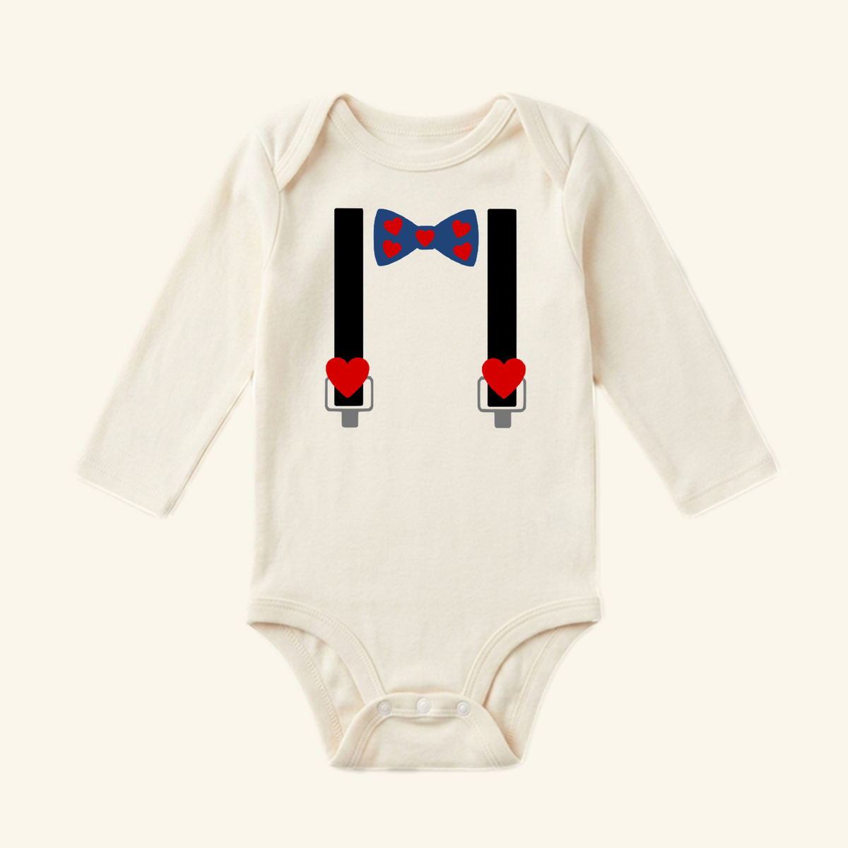 Toodleroos Valentine’s Day Baby Onesie – Heart Bow Tie & Suspenders Bodysuit featuring a blue heart-patterned bow tie and black suspenders with red heart accents.